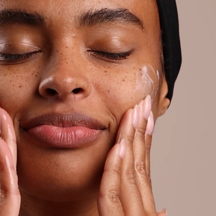 model using eminence organics calm skin chamomile moisturizer