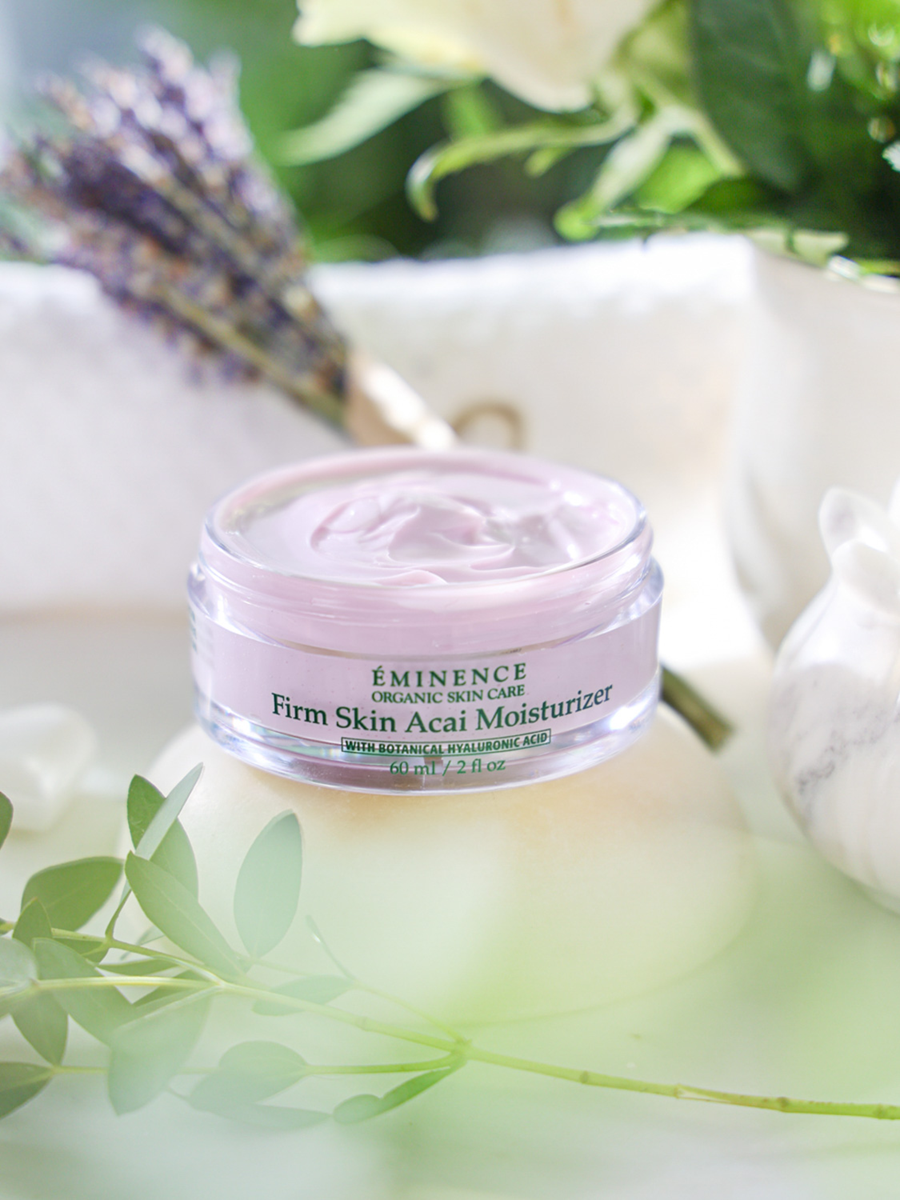 Eminence Firm Skin Acai Moisturizer jar with lavender and greenery in the background