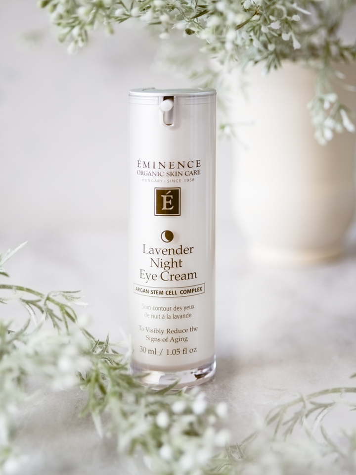 Eminence Lavender Night Eye Cream bottle with floral background