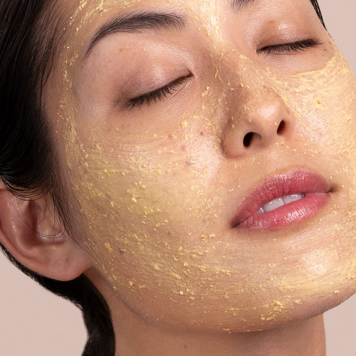 woman with Eminence Organics Seabuckthorn Balancing Masque on her face