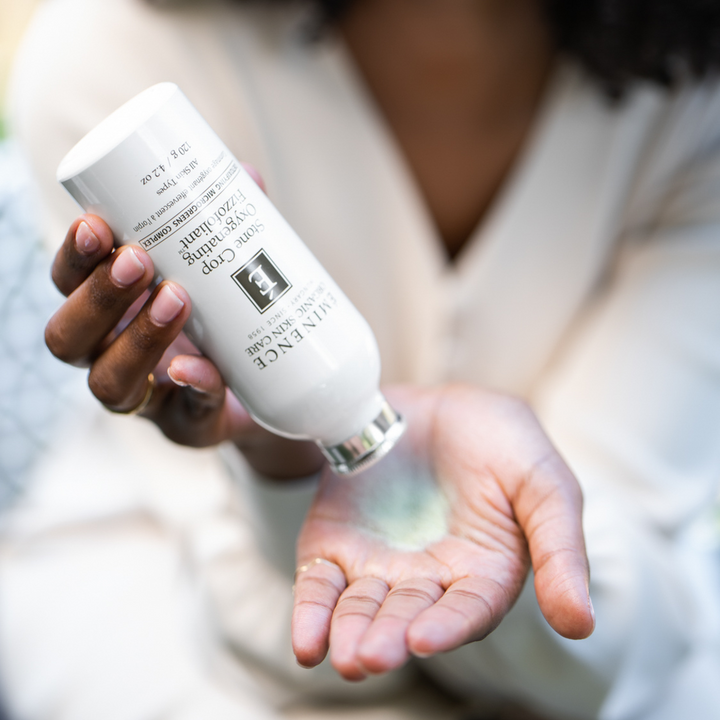 woman using Eminence Organics Stone Crop Oxygenating Fizzofoliant in her hand
