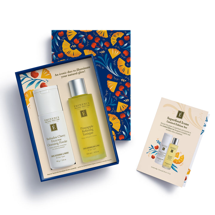 Eminence Organics Superfood Icons Limited Edition Set featuring a boxed hair care set with a white body wash and a yellow-toned treatment bottle, alongside a separate illustrated insert card on a clean white background.