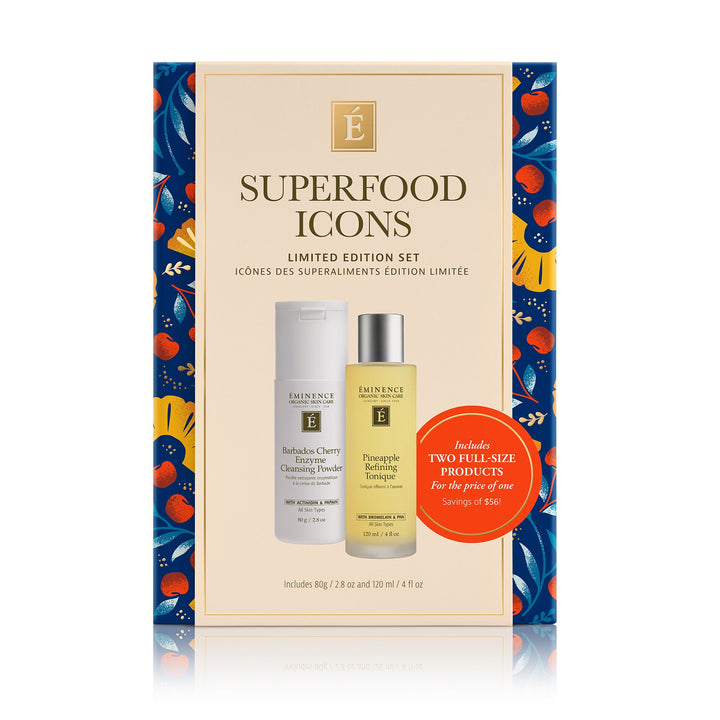 Eminence Organics Superfood Icons Limited Edition Set. The package has a cream center panel with blue floral side panels and two product bottles pictured on the front: a white bottle on the left and a yellow bottle on the right, plus a red circular callout.
