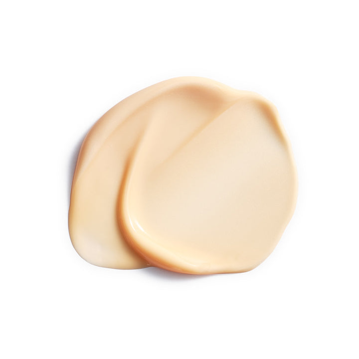 A smooth, creamy swatch of Eminence Organics Vitamin C+ Eye Cream showing a glossy, thick texture on a solid white background.