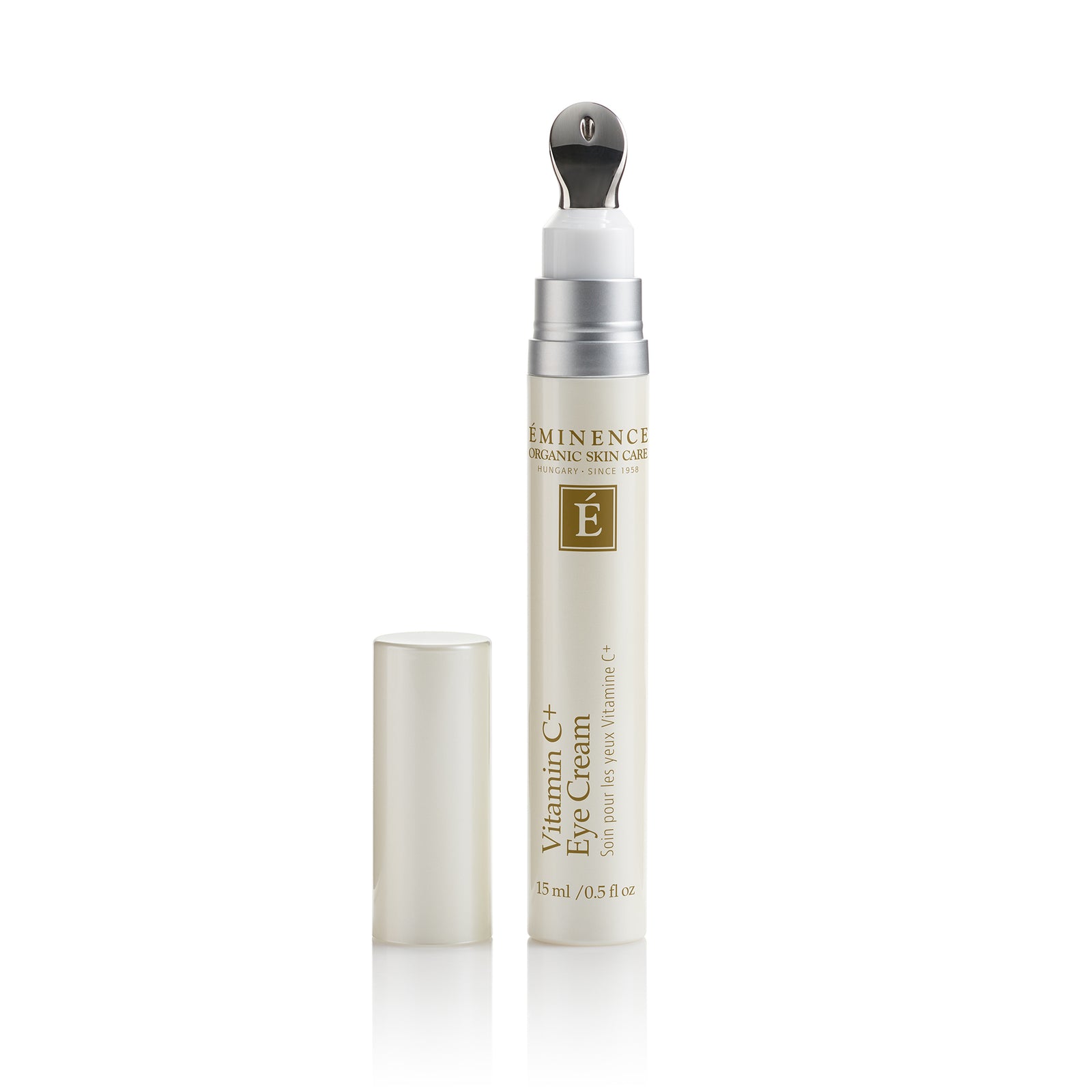 A tube of Eminence Organic Skincare Vitamin C Eye Cream with its cap removed, standing next to it on a clean white background.