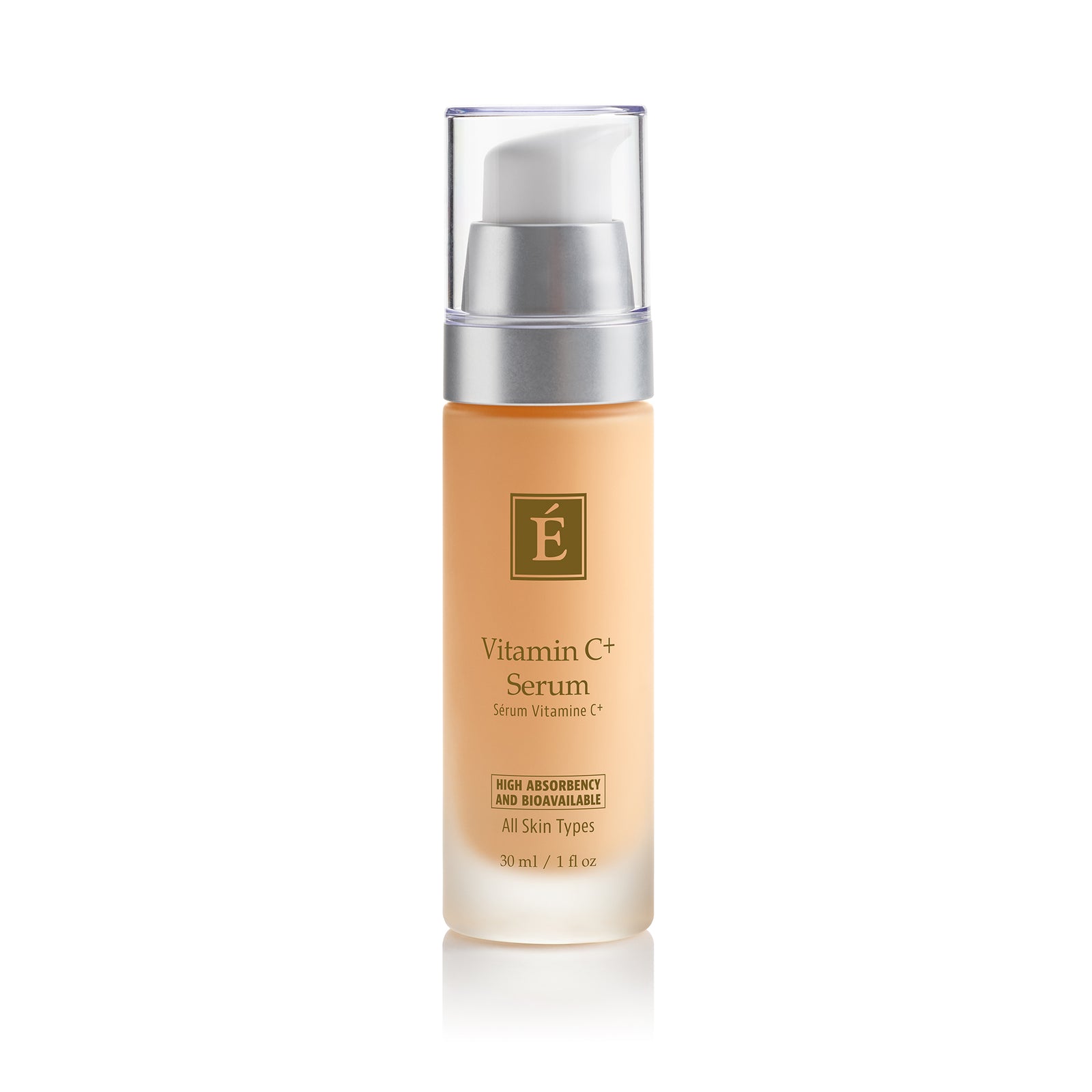 A 30 ml pump bottle of Eminence Organics Vitamin C+ Serum, featuring a light peach-colored body, a silver pump collar, and a clear cap, set against a plain white background with a soft reflection.