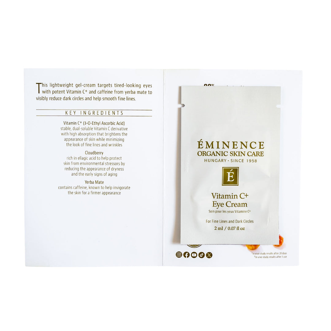 Eminence Organic Skin Care Vitamin C Eye Cream Sample shown on a white background, including the front sachet and the back insert card with text and ingredients.