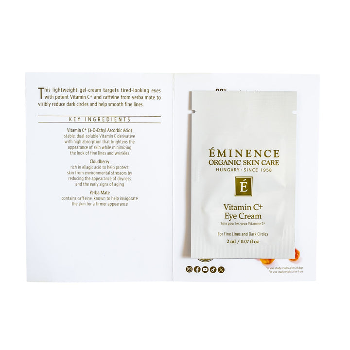 Eminence Organic Skin Care Vitamin C Eye Cream Sample shown on a white background, including the front sachet and the back insert card with text and ingredients.