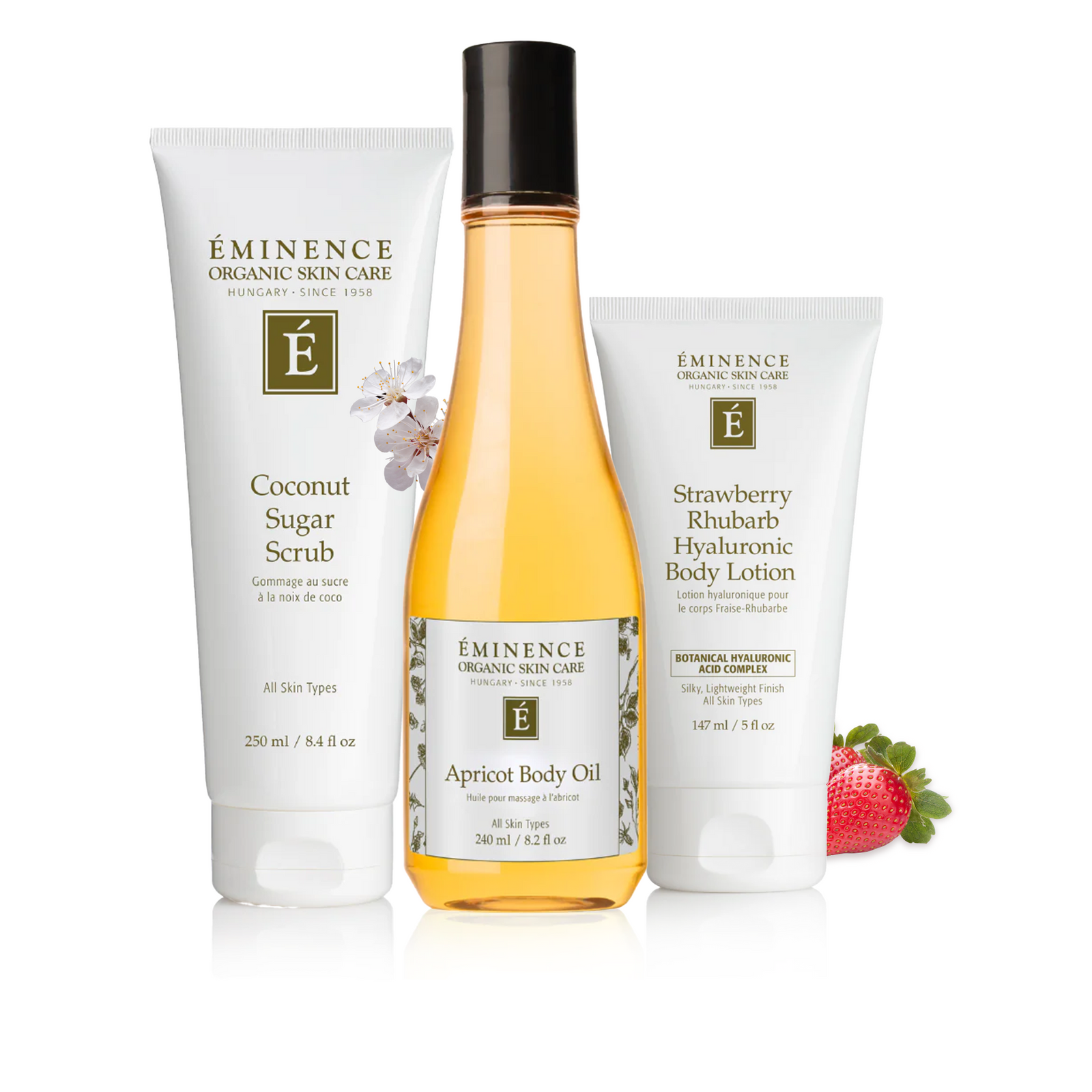 Eminence Organic Skin Care products including Coconut Sugar Scrub, Apricot Body Oil, and Strawberry Rhubarb Hyaluronic Body Lotion on a white background.