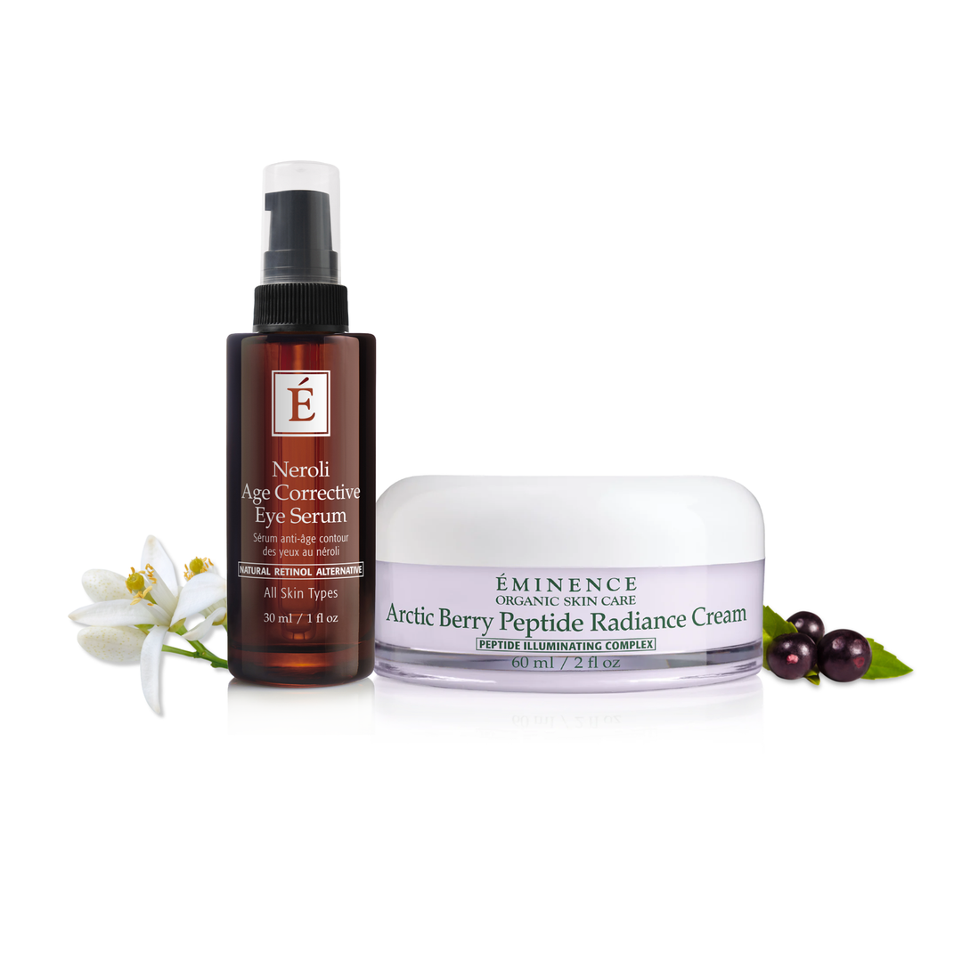 Two skincare products from Eminence Organics on a white background with flowers and berries.