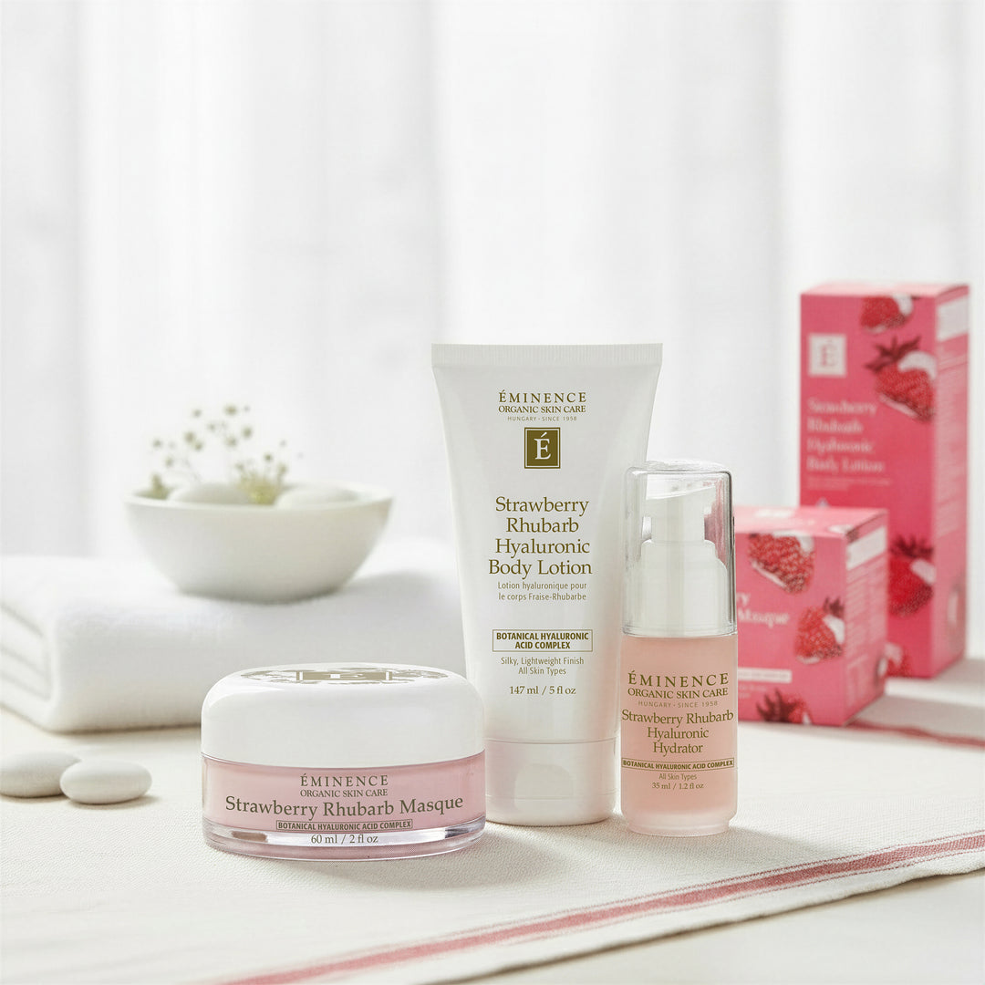 Eminence Organics Strawberry Rhubarb Trio - Limited Edition with packaging in the background lifestyle