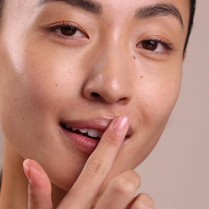 Eminence Organics Citrus Lip Balm lifestyle imagery of application